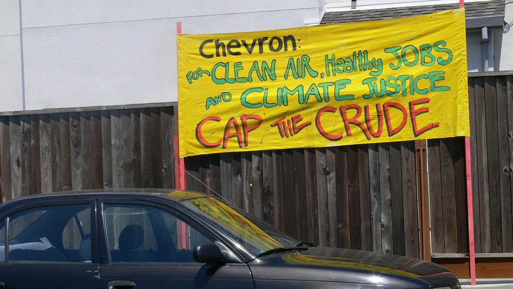 Signage that reads, 'Chevron: For Clean Air, Health Jobs and Climate Justice, Cap the Crude,' from a mass mobilization at the Chevron Oil Refinery in Richmond on August 15, 2009.