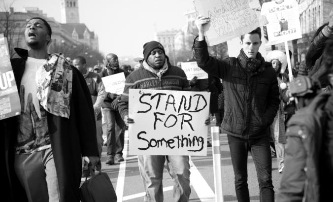 Protesters march against police shootings and racism during a rally Dec. 13, 2014 in Washington, D.C.