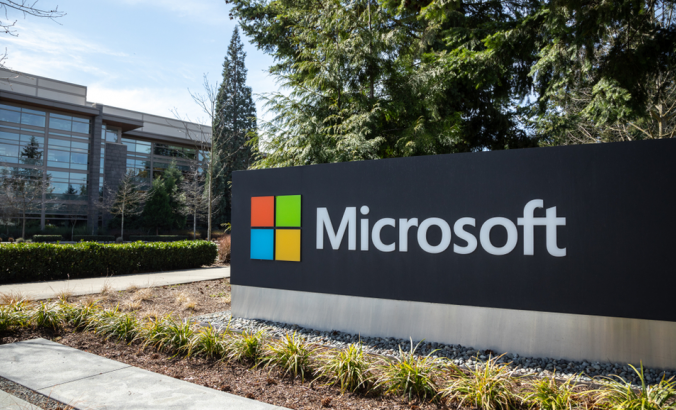 Microsoft sign at the headquarters for the cloud computer and software company, with office building in the background