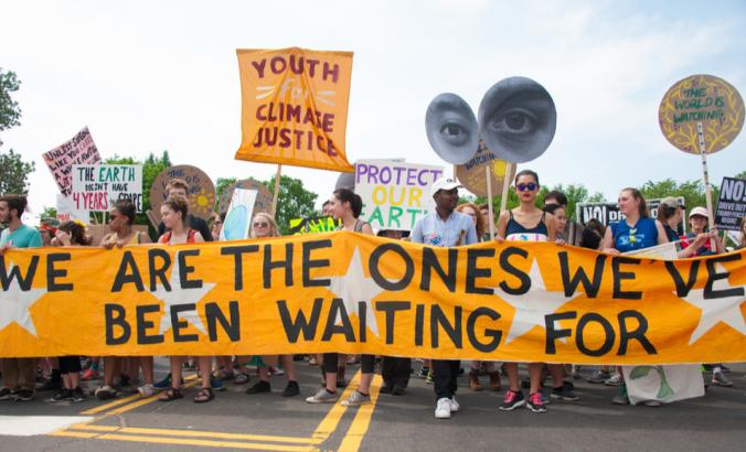 Protesters at the People’s Climate March highlight the need to take action on climate change in Washington DC on April 29, 2017