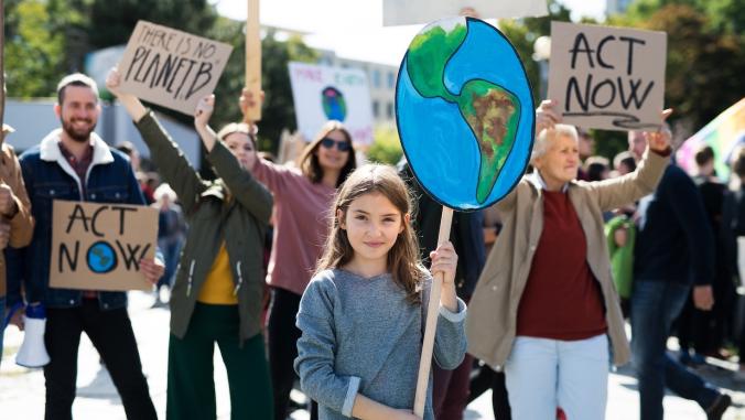 Protesters holding signs