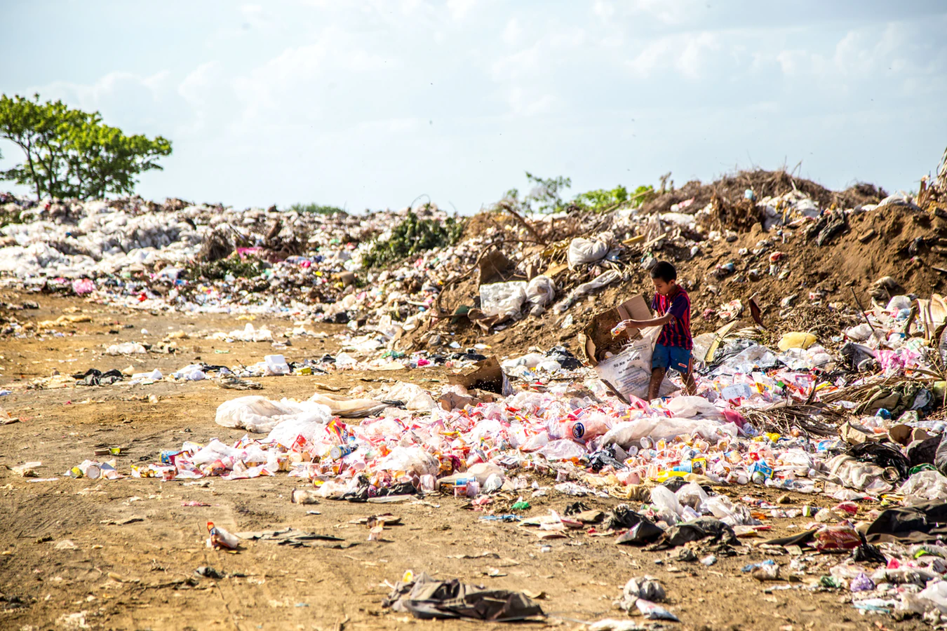 boy in landfill